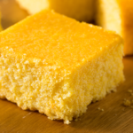 homemade cornbread on a wood cutting board