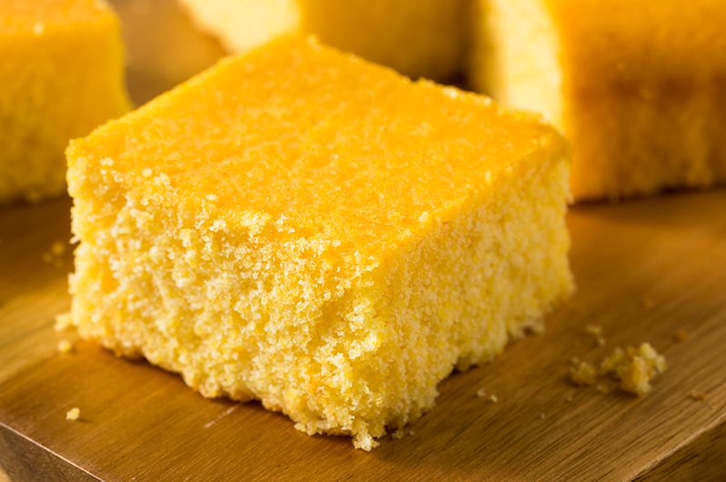 Cornbread homemade cornbread on a wood cutting board